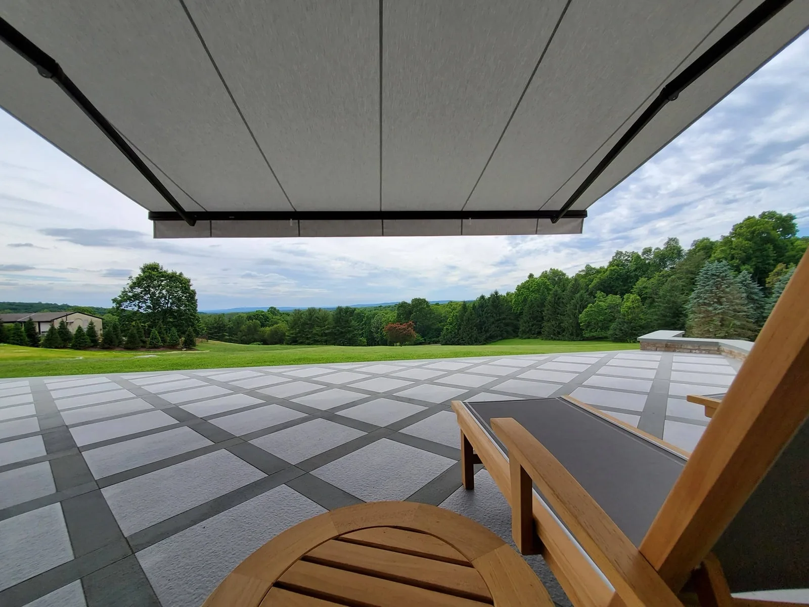 Retractable awning installed over outdoor seating
