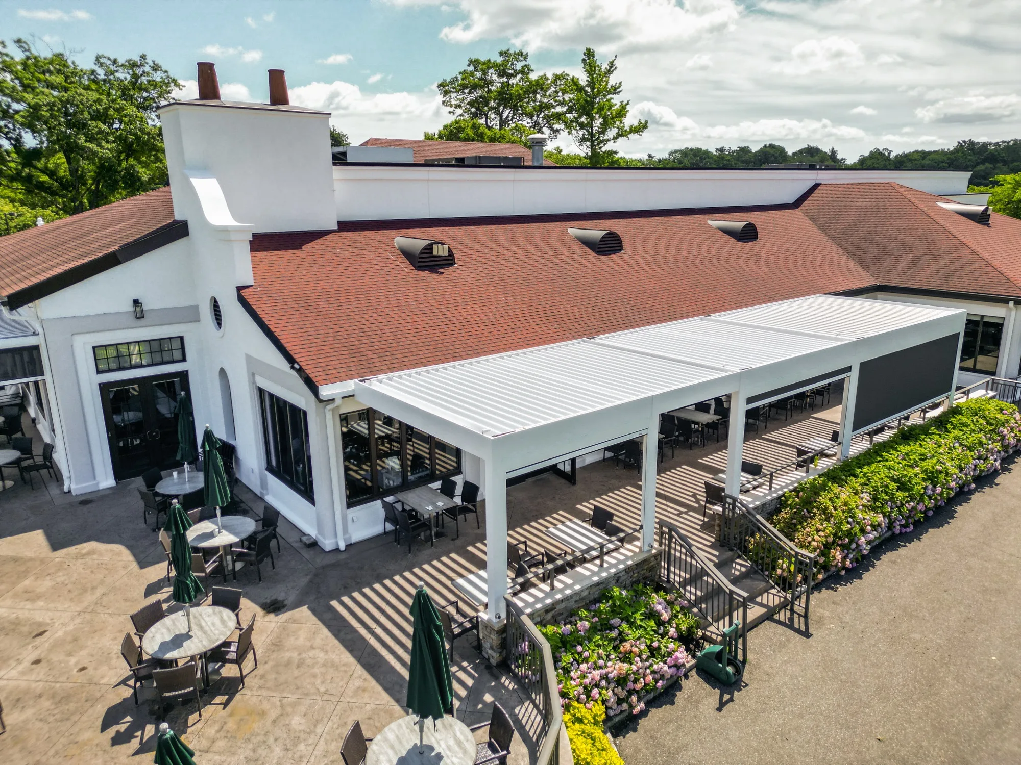 Aerial view of commercial pergola installation at a country club
