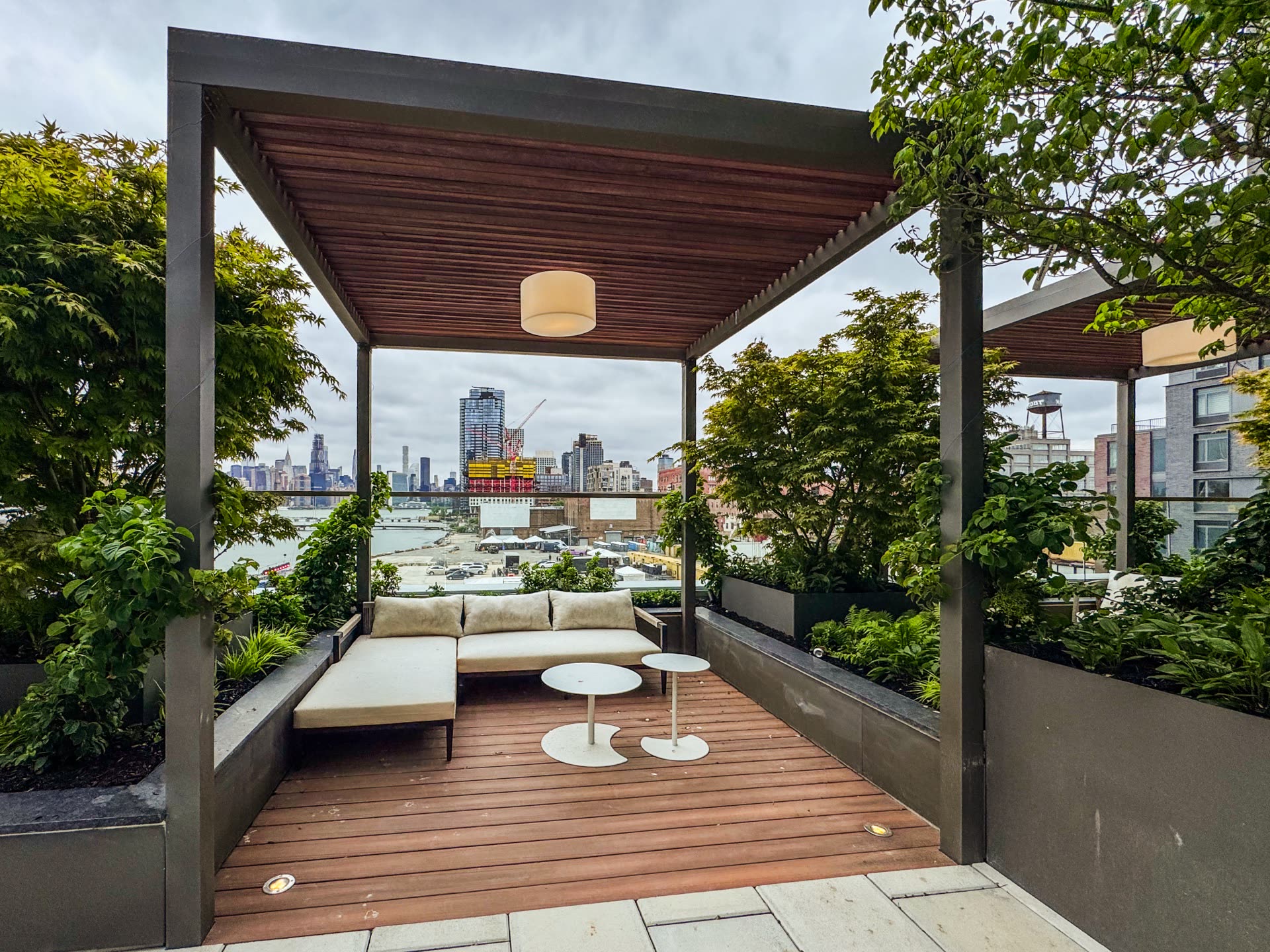 Urban Top Brooklyn — Breslow-installed Azenco R-Blade motorized louvered roof framing the Manhattan skyline