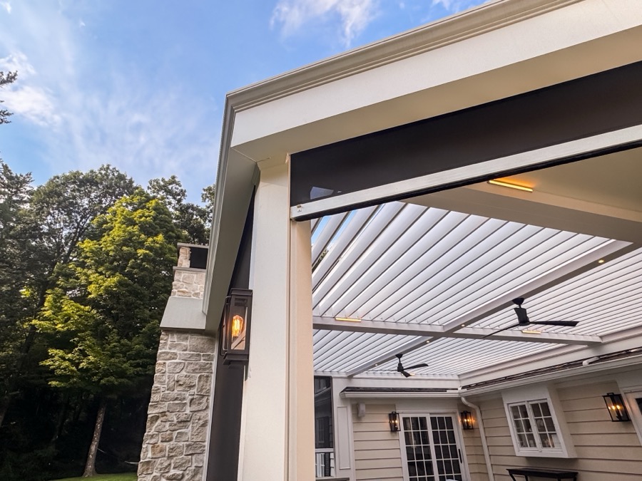 Motorized screen shades — covered outdoor living room