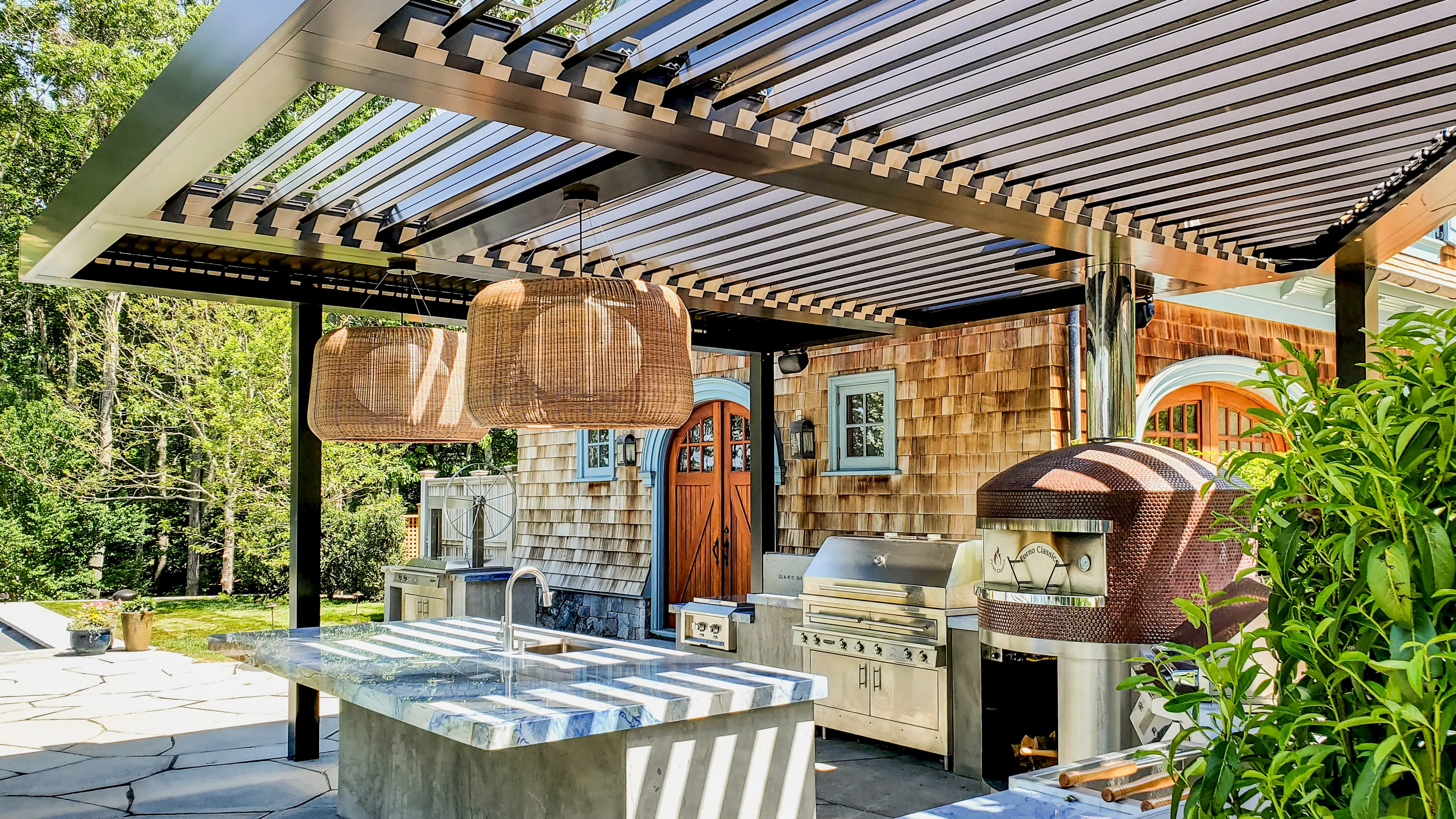 Modern outdoor kitchen with integrated pergola