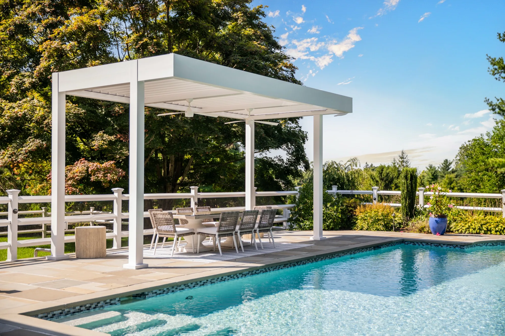 Modern poolside louvered pergola