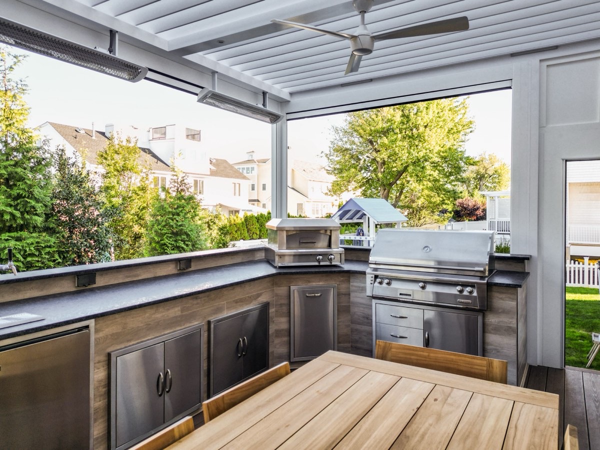 Monmouth Beach, NJ — Deck-mounted louvered roof with TV wall and outdoor kitchen